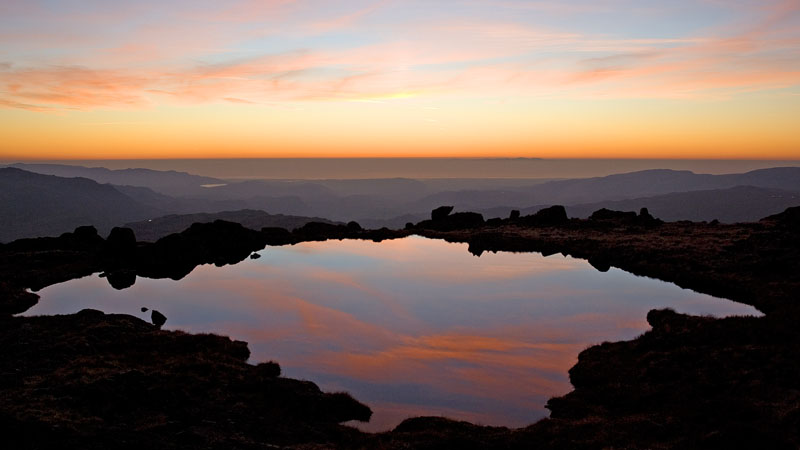 Reflected sunset in tarn on Little Stand Reflected sunset in tarn on Little Stand