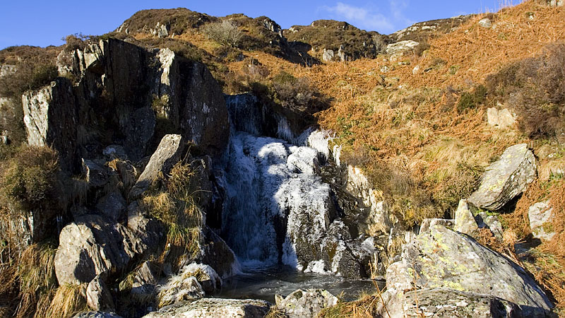 Part frozen waterfall ascending to Llyn y Foel