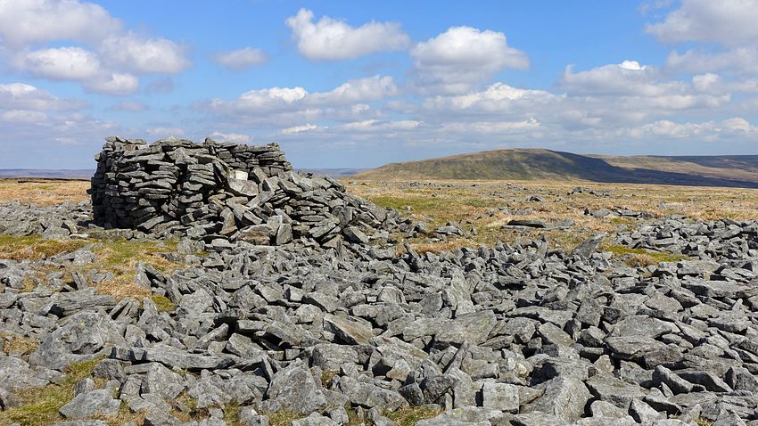 Enclosed broken 745m trig point on Little Fell