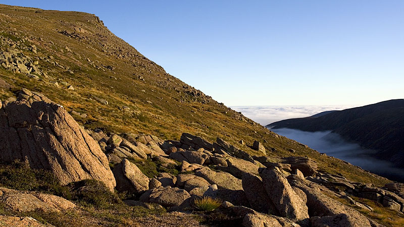 Climbing Cairn Gorm with inversion below Climbing Cairn Gorm with inversion below