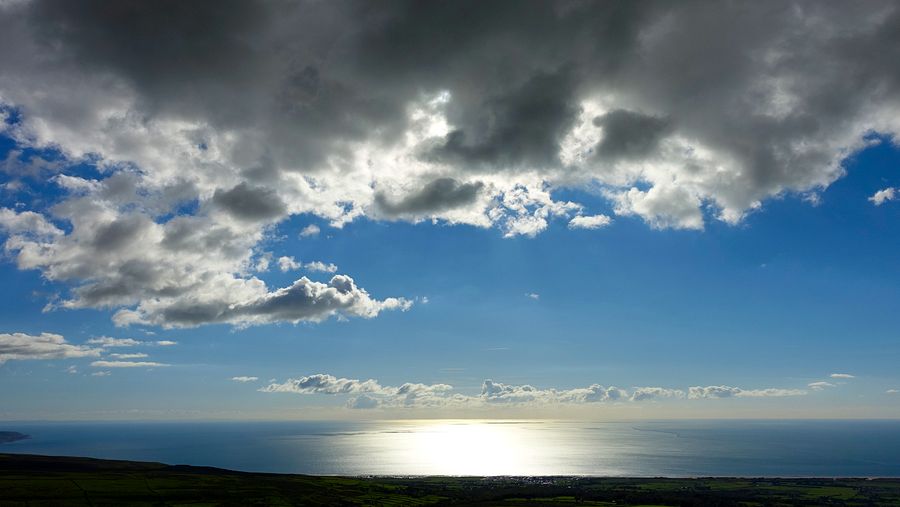 Cloud and sun on the sea from Moelfre